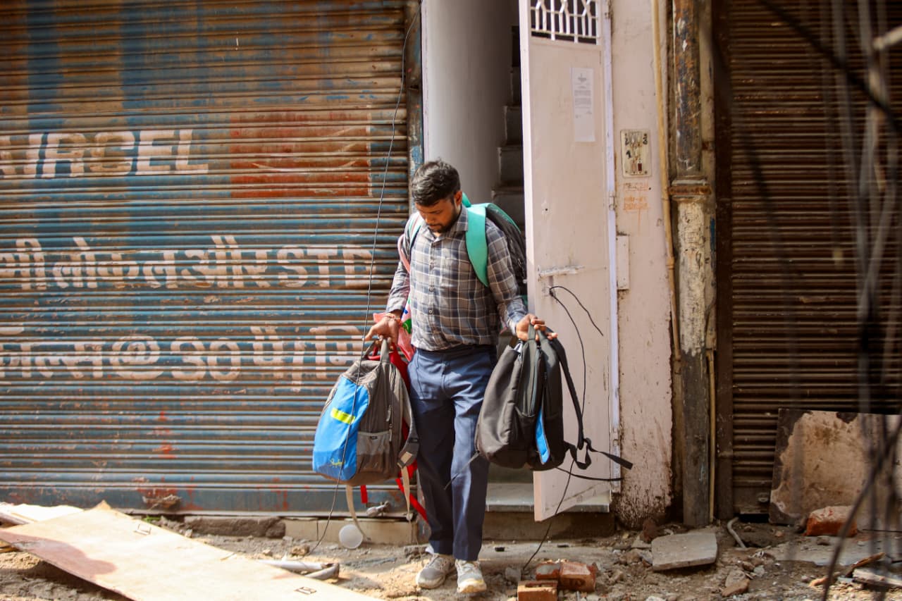 Students move their belongings out of rented accommodation in Delhi’s Satya Niketan, a day after a private hostel building collapsed in the area. 