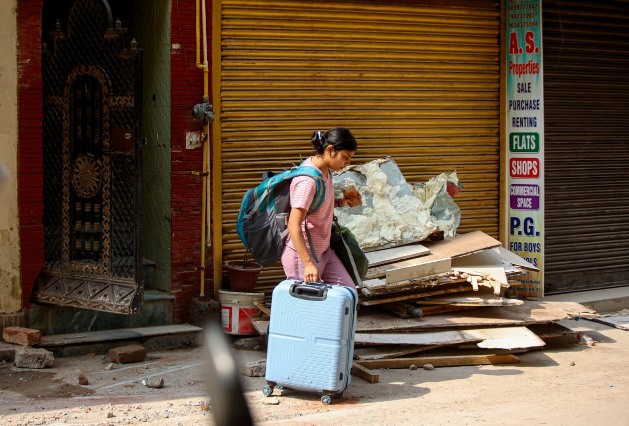 Students move their belongings out of rented accommodation in Delhi’s Satya Niketan, a day after a private hostel building collapsed in the area. 