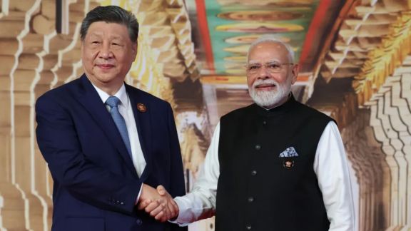 Prime Minister Narendra Modi greets Chinese President Xi Jinping upon his arrival for the BRICS summit in New Delhi, India, on Saturday, September 12, 2026. (Foreign Ministry via AP) China