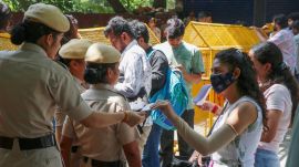 Security personnel check students' identity cards as security tightens across Delhi University's North Campus ahead of Delhi University Students' Union (DUSU) election nomination filings, in New Delhi on Thursday. (ANI Photo)