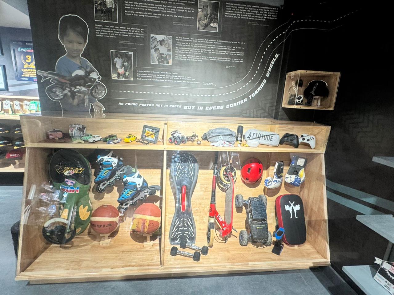 Model cars, kickboxing gloves, and videogame controllers - a child in some ways, a driven athlete in others.