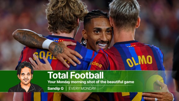 Barcelona's Raphinha (center) hugs teammates Anthony Gordon (left) and Dani Olmo during a Spanish La Liga soccer match between Barcelona and Rayo Vallecano. (AP Photo)