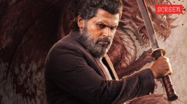 Karthi in a dual role as Agent Sardar Chandra Bose and Agent Vijay Prakash in Sardar 2,