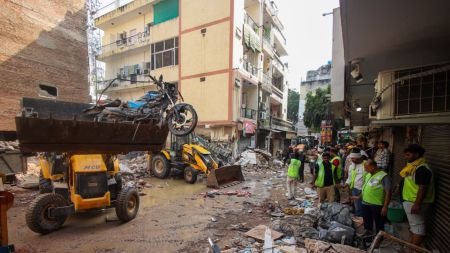 Rescue by the SDRF, ITBP and other agencies after a multiple storey building collapsed at Satya Niketan, New Delhi, on Sunday. (Express Photo by Afshana Ali)