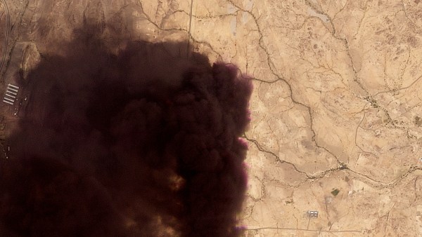 A plume of black smoke rises from a Saudi Aramco oil refinery on Tuesday, Sept. 8.