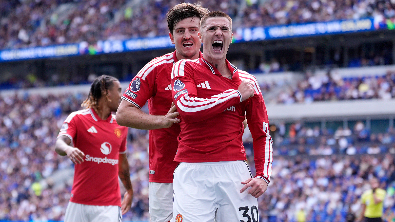 Manchester United's Benjamin Sesko, right, celebrates scoring their side's second goal of the game during the English Premier League soccer match between Everton and Manchester United in Liverpool, England, Sunday, Sept. 6, 2026. (Peter Byrne/PA via AP)
