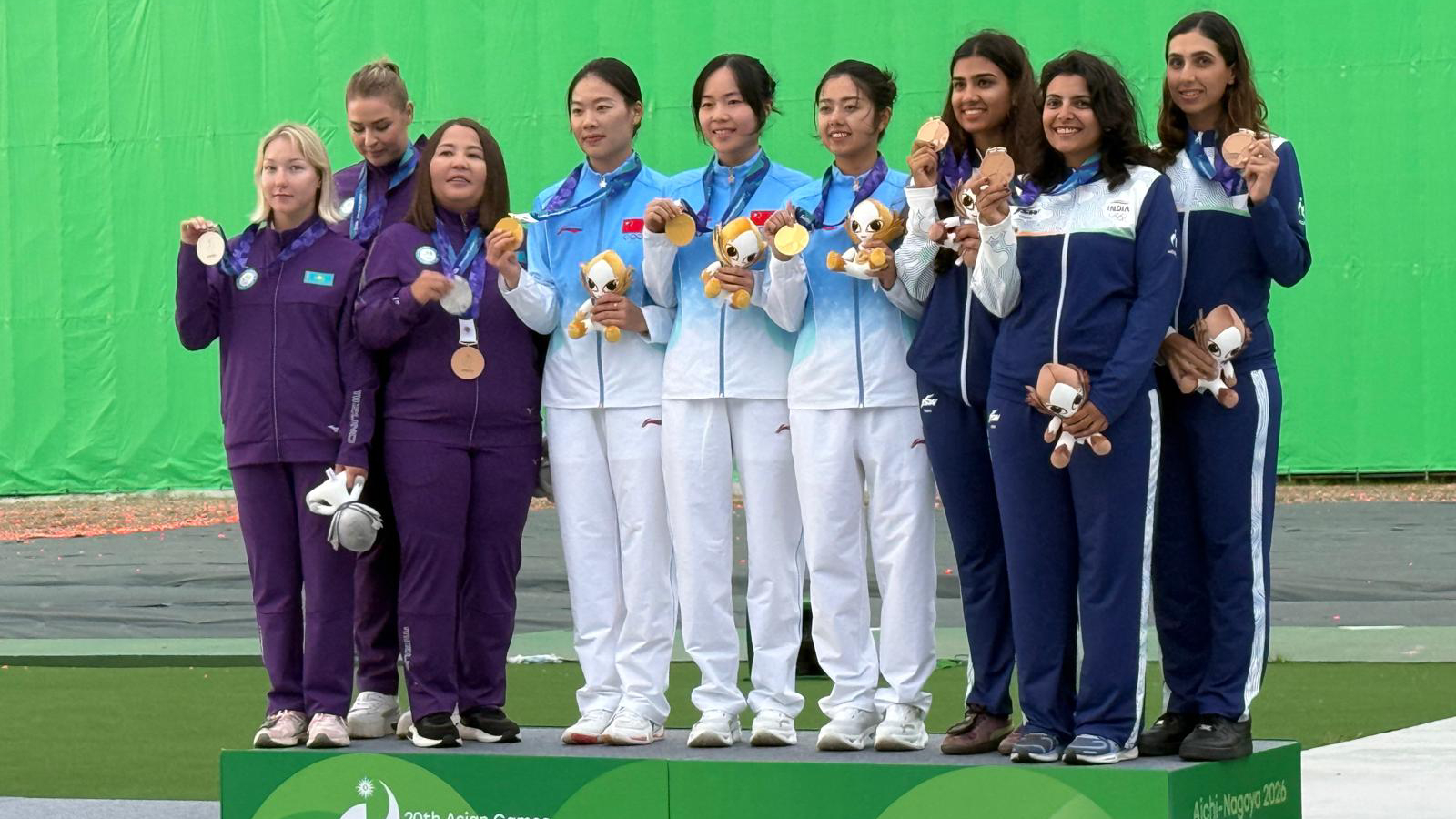 India's Raiza Dhillon, Maheshwari Chauhan and Parinaaz Dhaliwal pose with the team bronze medal on the podium. (NRAI)