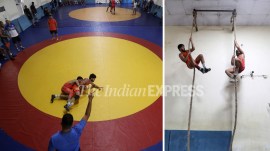 Wrestlers busy in their grind at the Raipur Sports Academy in Sonepat, Haryana. (Express Photo by Gajendra Yadav)