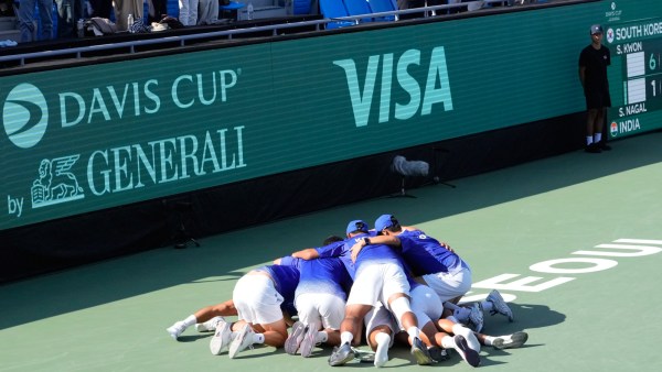 South Korean players celebrate after winning against India during Davis Cup second round qualifier.