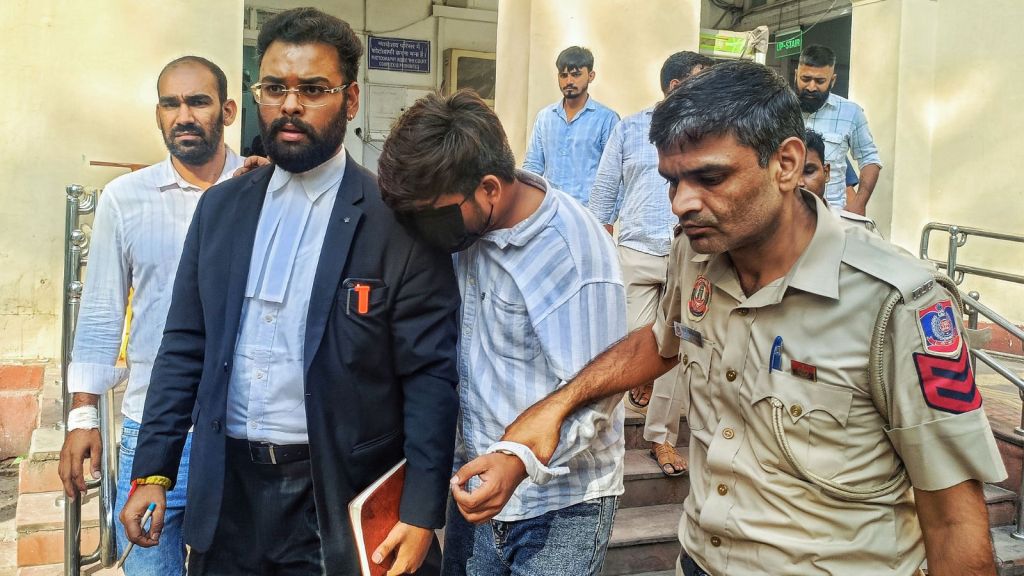 Delhi Police brings Sudhanshu, one of the three accused in the Satya Niketan building collapse incident, to produce before the Patiala House Court, in New Delhi on Wednesday. (ANI Photo)