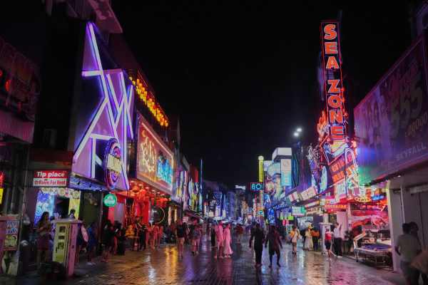 Tourists stroll down Walking Street in Pattaya, Thailand, on Aug. 31, 2026. (AP Photo/Sakchai Lalit)
