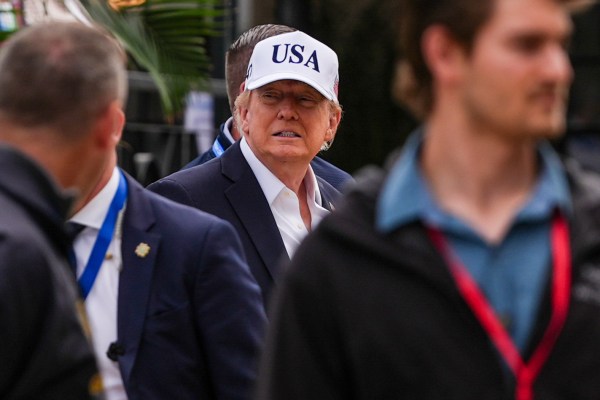 U.S. President Donald Trump, center, attends the Irish Open golf tournament at Trump International Golf Links in Doonbeg, Ireland, Sunday, Sept. 13, 2026.