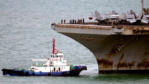 A tug boat greets the US Navy aircraft carrier USS Abraham Lincoln as it arrives at the port in Laem Chabang, Chonburi, Thailand, Wednesday, Sept. 2, 2026. (AP)