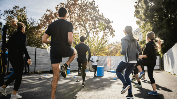 People staying fit through dancing, walking and recreational sports to burn calories without a gym workout