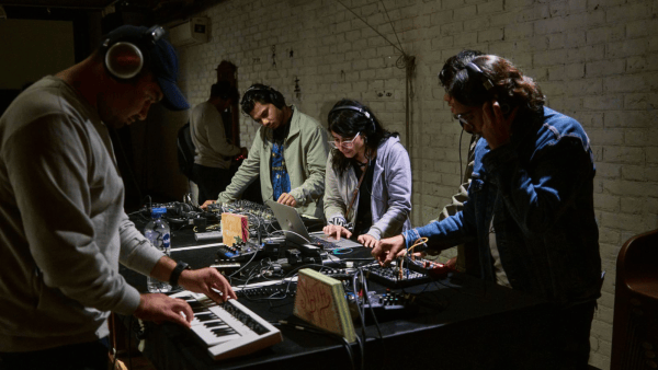 Young musicians try their hand at synths in the listening stations