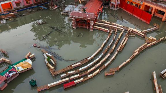 Swollen Ganga river partially submerges the area outside the Bade Hanuman Ji Temple, in Prayagraj, Sunday, Sept. 6, 2026. (PTI Photo)