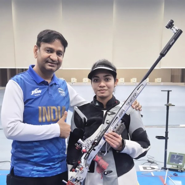 Indian shooter Vidarsa K Vinod with her coach Manoj Kumar.