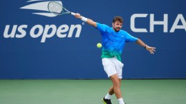 Stan Wawrinka, of Switzerland, returns the ball to Matteo Berrettini, of Italy, during the first round of the US Open tennis championships Monday, Aug. 31, 2026, in New York. (AP Photo/Yuki Iwamura)