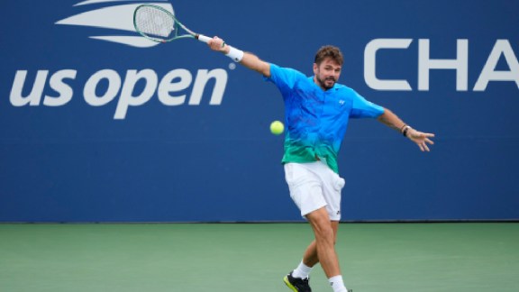 Stan Wawrinka, of Switzerland, returns the ball to Matteo Berrettini, of Italy, during the first round of the US Open tennis championships Monday, Aug. 31, 2026, in New York. (AP Photo/Yuki Iwamura)