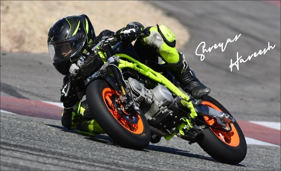 Shreyas Hareesh performing a skilful and highlytechnical turn at high speed during a race.