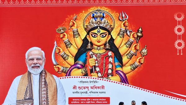The backdrop at the West Bengal government’s Durga Puja coordination meeting shows Goddess Durga with 10 arms, unlike the 11-armed depiction in the newspaper advertisement. (Special Arrangement)