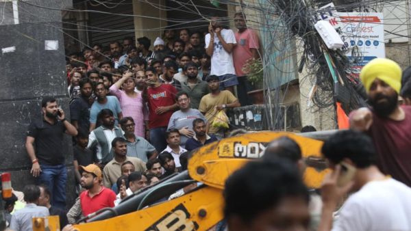 Chaos at Nearby PGs after building collapse incident in Delhi. (Express Photo by Abhinav Saha)
