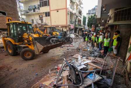Rescue underway a day after building collapsed at Satya Niketan in New Delhi on Monday. (Express Photo: