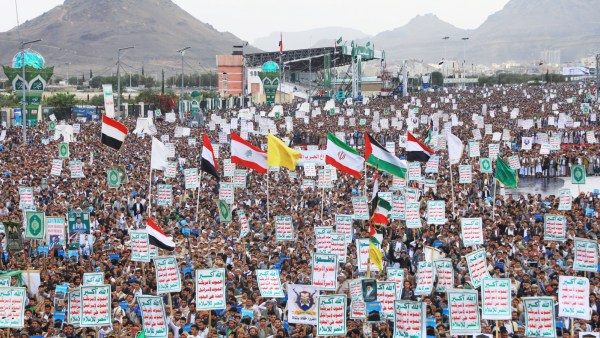 Houthi supporters gather in Yemen's Sanaa to protest Saudi Arabia’s accusation that the Houthis targeted Islam’s holiest site, Mecca. (AP)