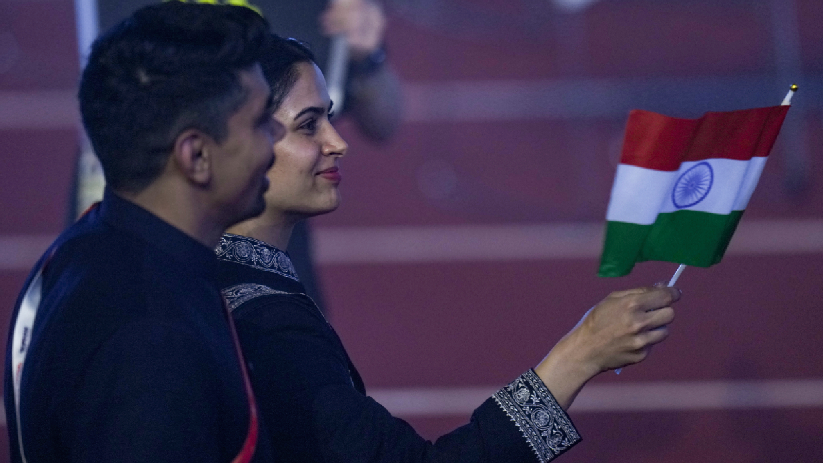 Indias double Olympic medalist from Paris 2024 Manu Bhaker and kabaddi player Pawan Sehrawat lead the contingent at the athletes parade, during the opening ceremony of the 20th Asian Games, in Nagoya, Japan, Saturday, Sept. 19, 2026.