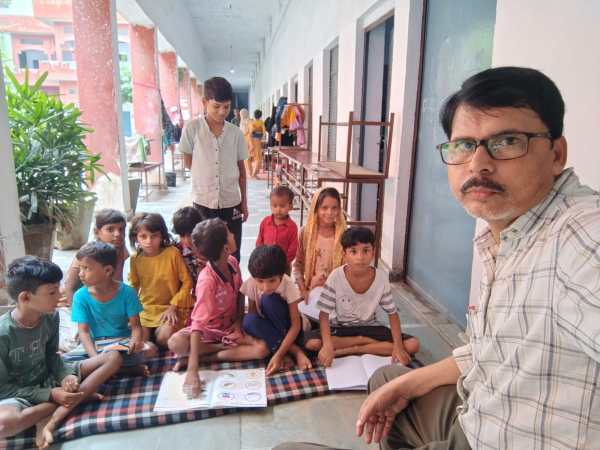 Teacher Mohammad Sayeed has been teaching 11 children at a camp housing families from flood-hit Nakhi Ghat. (Special Arrangement)