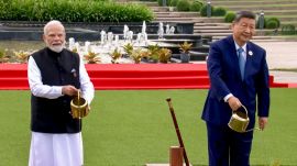 Prime Minister Narendra Modi with Chinese President Xi Jinping during a joint tree plantation initiative amid the ongoing 18th BRICS Summit, at the Bharat Mandapam, in New Delhi. (@NarendraModi/YT via PTI Photo)