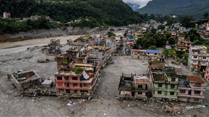 A drone view shows a damaged residential building along the swollen Trishuli River in the aftermath of flash floods in Nepals Nuwakot district, Thursday, Sept. 3, 2026. (AP Photo)