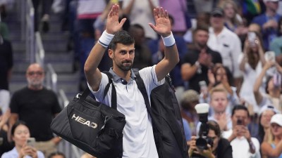 Novak Djokovic, of Serbia, gestures to the crowd after he lost to Mariano Navone, of Argentina, during the first round of the U.S. Open tennis championships Sunday, Aug. 30, 2026, in New York. (AP Photo/Frank Franklin II)
