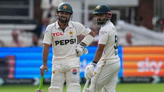 Pakistan's Mohammad Rizwan, left, stands with batting partner Saud Shakeel on day four of the second cricket Test match between England and Pakistan. (AP Photo)