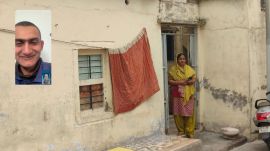 Hasina Majothi at her home in Morbi, Gujarat. She is fighting to get her son, Sahil (inset), back home