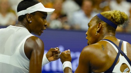 Venus Williams, right, and Serena Williams, of the United States, fist bump during the third set as they play against Hao-Ching Chan, of Taiwan, and Maya Joint, of Australia, during a women's doubles match at the U.S. Open tennis championships, Friday, Sept. 4, 2026, in New York. (AP Photo)