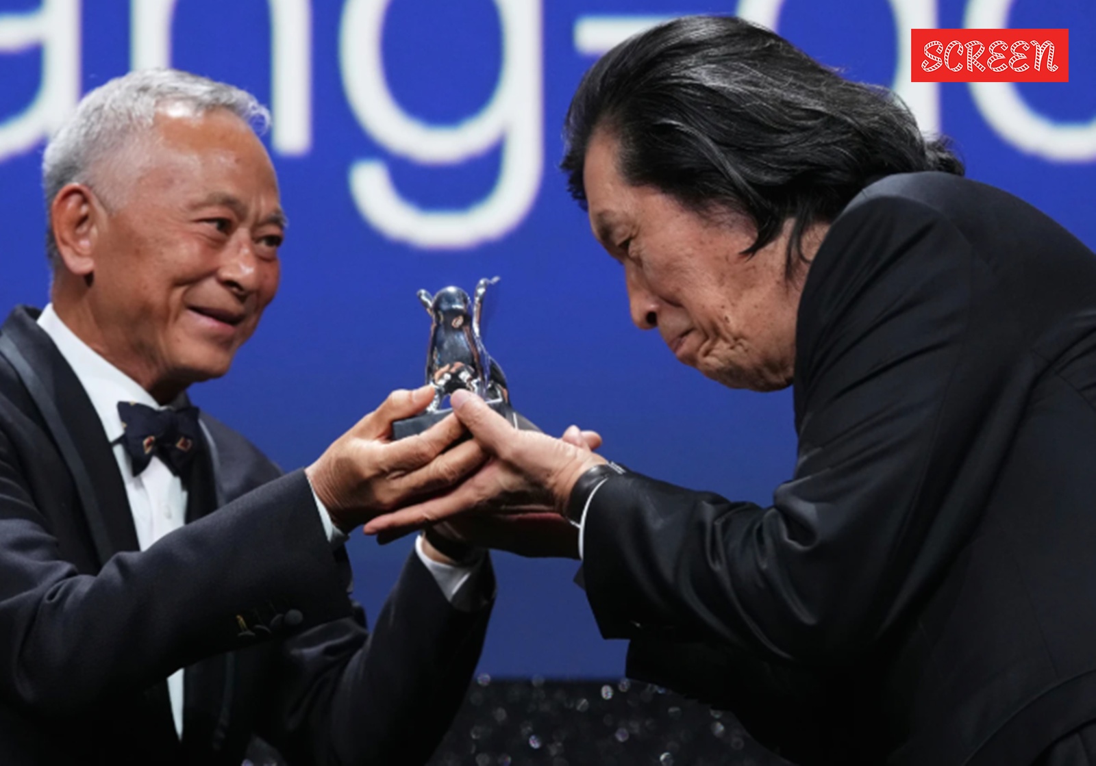 Jury member Johnnie To, left, presents director Lee Chang-dong the grand jury prize for the film ‘Possible Love’ during the closing ceremony of the 83rd edition of the Venice Film Festival in Venice, Italy, on Saturday, Sept. 12, 2026. 