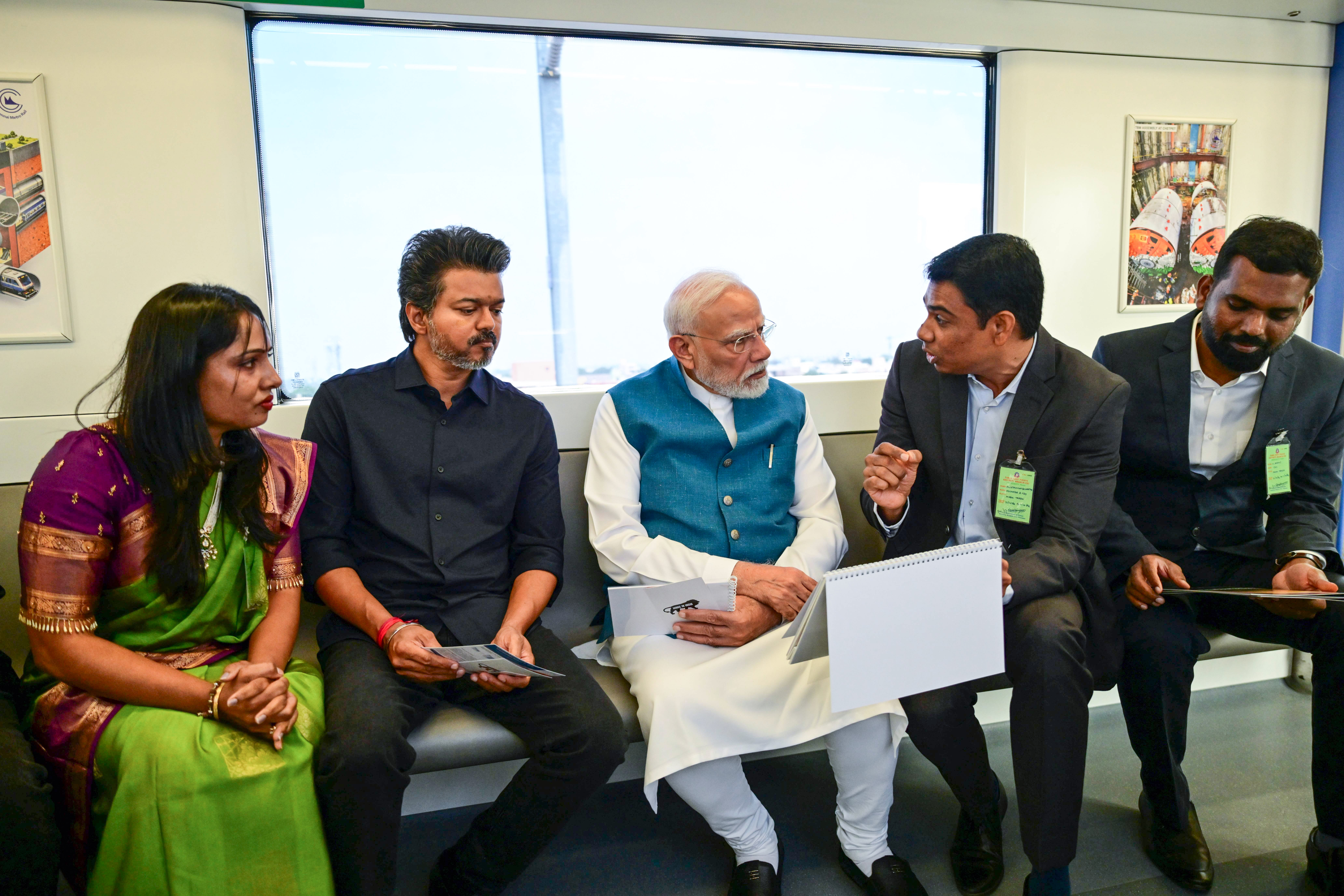 Prime Minister Narendra Modi and Tamil Nadu Chief Minister C. Joseph Vijay travel in a metro during the inauguration of the Poonamallee-Vadapalani stretch of Chennai Metro Phase-2, in Chennai on Sunday. ( DPR PMO/ANI Photo)