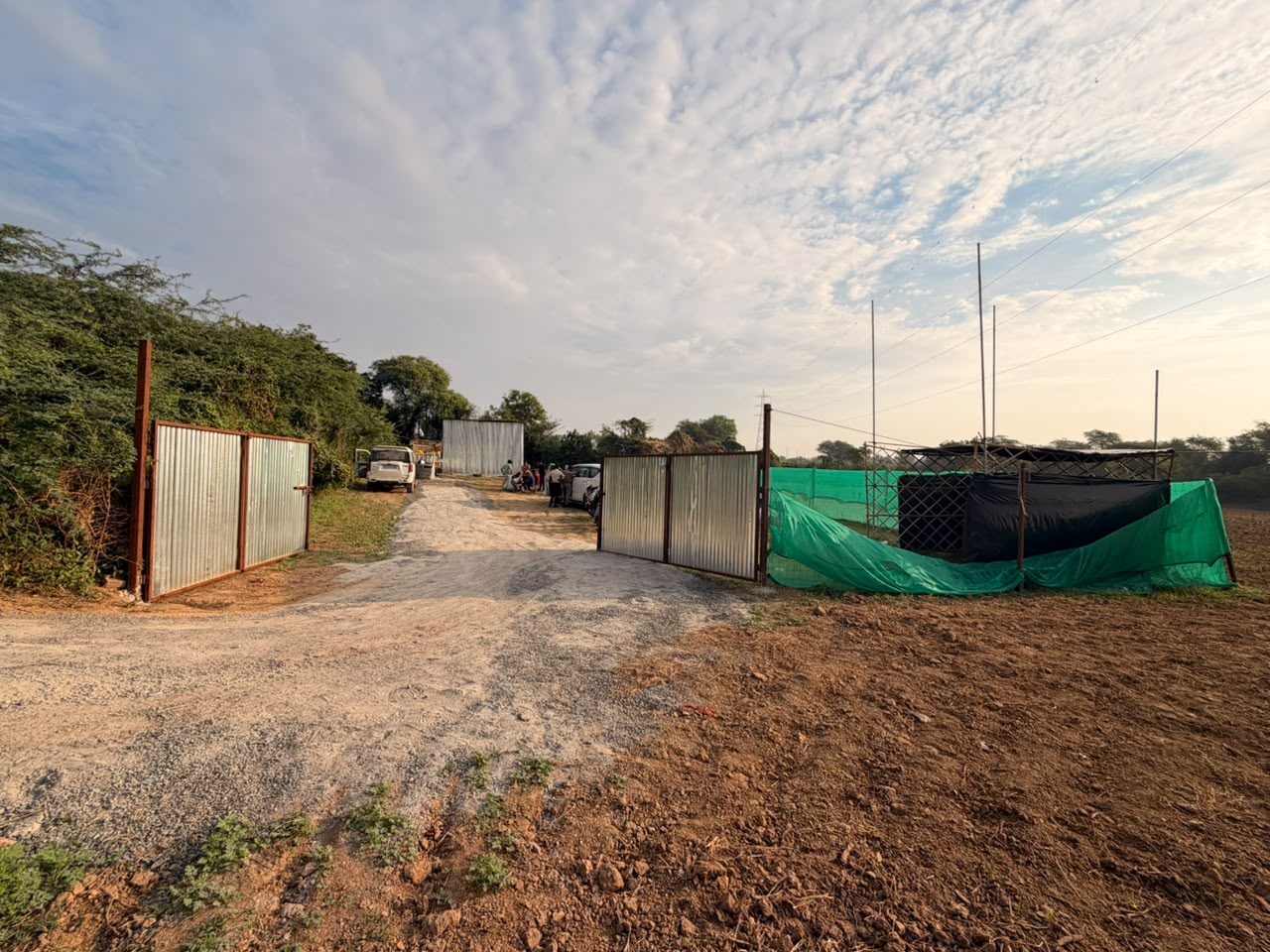 The fencing was covered with green fabric, keeping the activities inside out of public view.