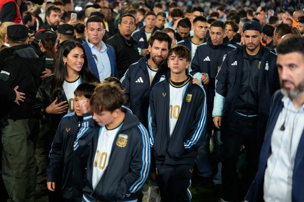 Lionel Messi and his family leave the field at the end of the friendly match against Benin, marking his farewell appearance for the national team, in Buenos Aires, Argentina. (AP Photo/Gustavo Garello)