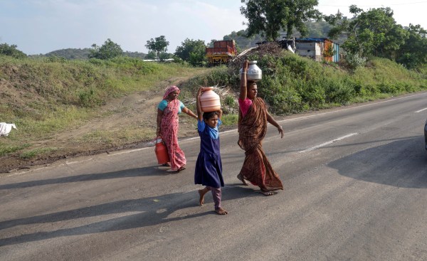 Disha Jadhav, 9, fetching water after school, at her village in Jalna district