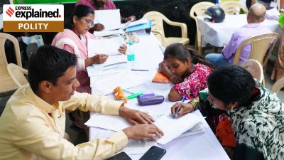 Form 6 mess: People served SIR (Special Intensive Revision) notices arrive at Appasaheb Kulkarni Primary School in Gokhalenagar on Monday with their documents. (Express Photo - Arul Horizon)