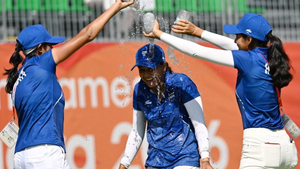 India's Pranavi Urs celebrates after winning the women's individual stroke play gold medal and women's team silver medal with Aditi Ashok and Diksha Dagar.