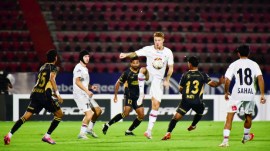 NorthEast United FC players and Mohun Bagan Super Giants FC players vie for the ball during the Indian Super League (ISL) football match between NorthEast United FC and Mohun Bagan Super Giants FC, in Guwahati, Monday, Oct. 12, 2026. (PTI Photo)