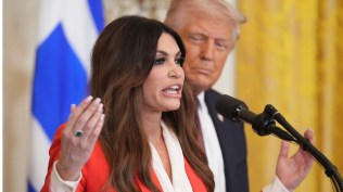 Kimberly Guilfoyle speaks as President Donald Trump listens at a reception celebrating Greek Independence Day in the East Room of the White House, March 24, 2025, in Washington. (AP Photo)