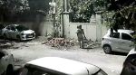 The man, who was carrying a child, was seen arriving with garbage