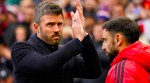 Manchester United's head coach Michael Carrick applauds supporters while Bruno Fernandes looks on ahead of the start of the English Premier League match between Manchester United and Bournemouth. (AP Photo)