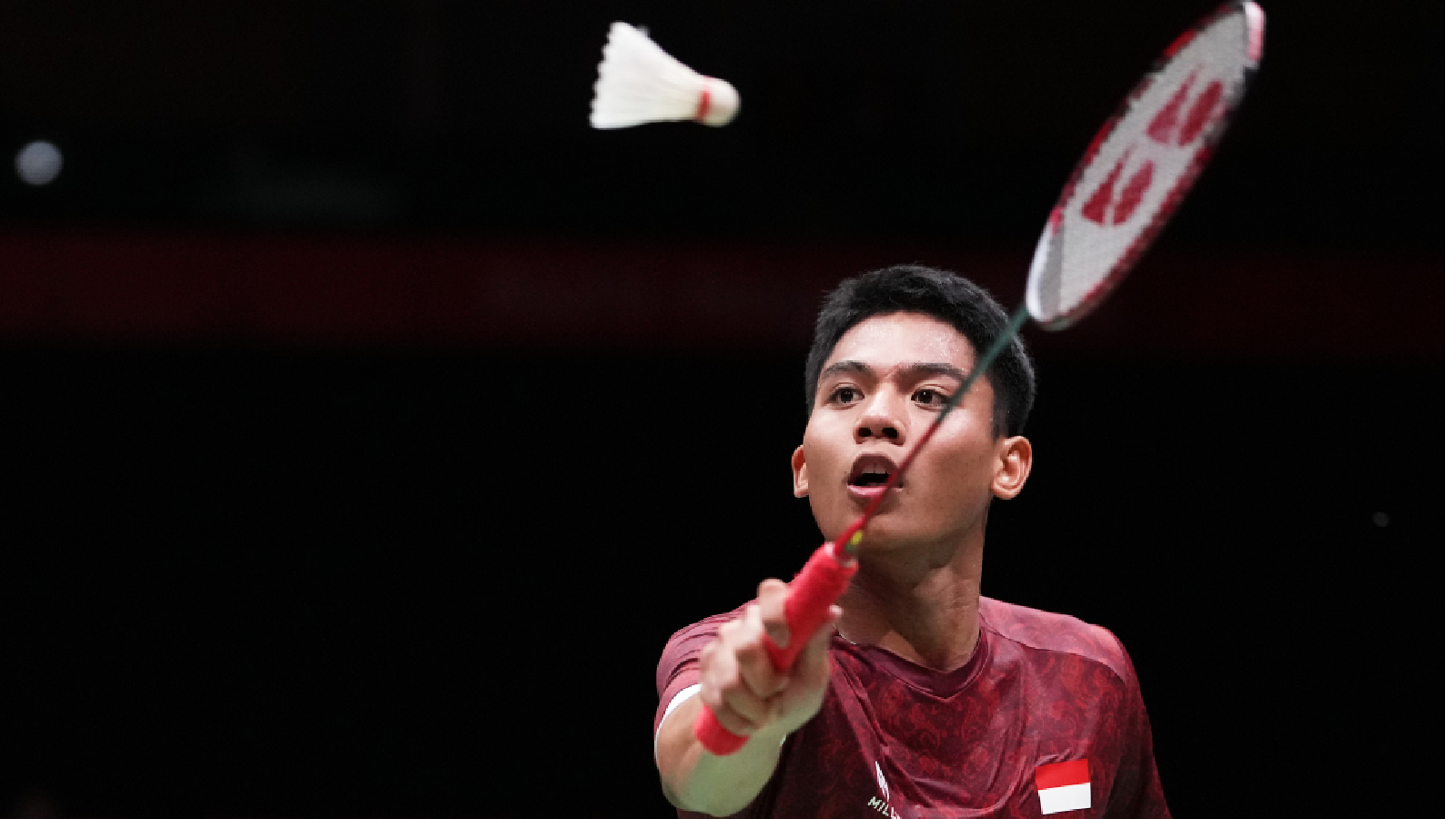 Indonesia's Moh Zaki Ubaidillah plays against China's Weng Hongyang in the men's badminton team final at the Asian Games in Ichinomiya City, Japan, Thursday, Sept. 24, 2026.