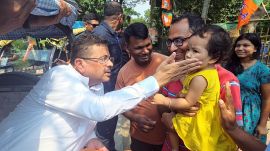 West Bengal Chief Minister Suvendu Adhikari interacts with a child during his visit to cast his vote for the high-stakes Nandigram Assembly by-election in Purba Medinipur on Tuesday (ANI).