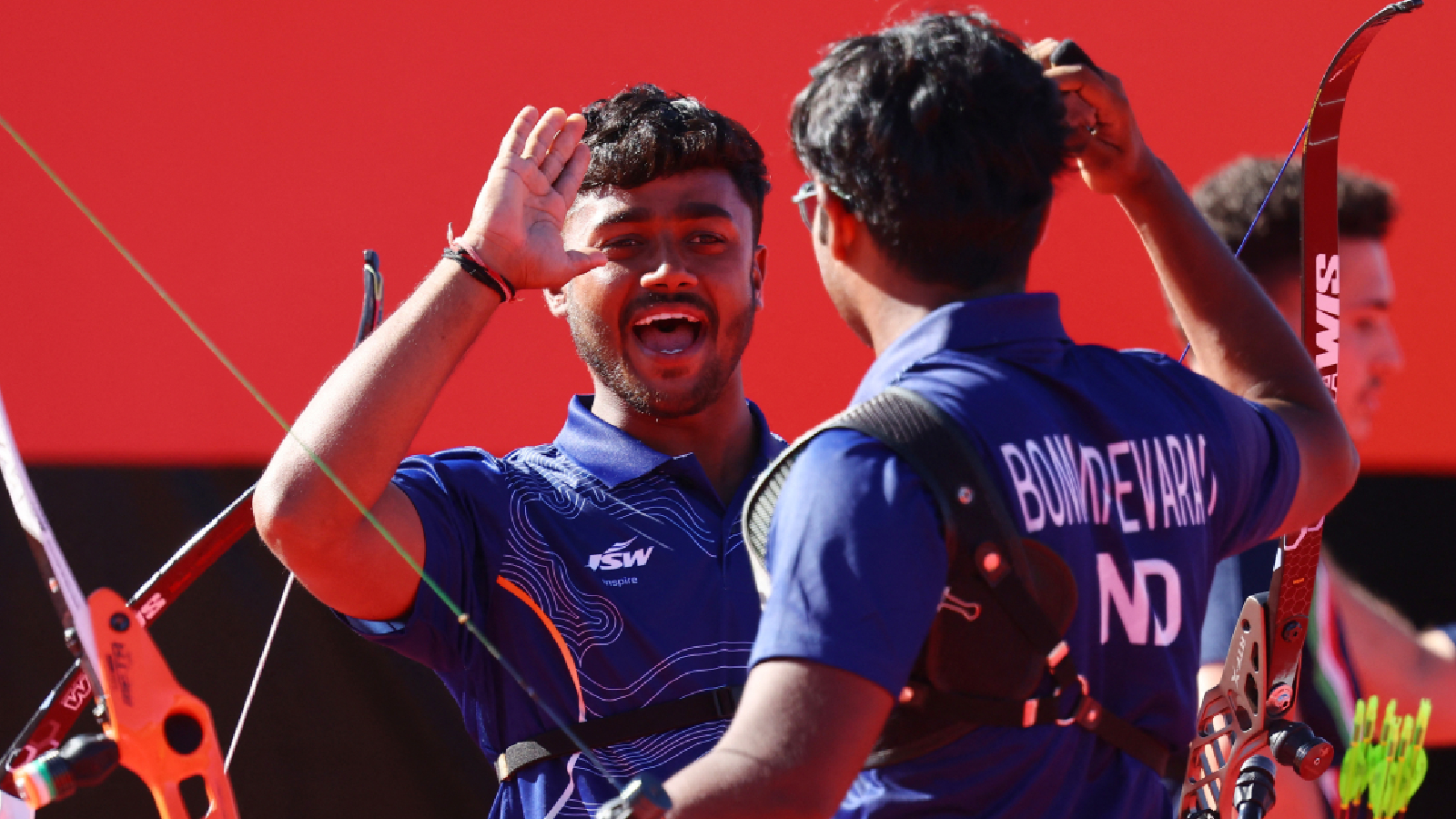 Indian archer Neeraj Chauhan celebrates with teammate Dhiraj Bommadevara at the Asian Games in Okazaki Central Park Multipurpose Square, Okazaki.